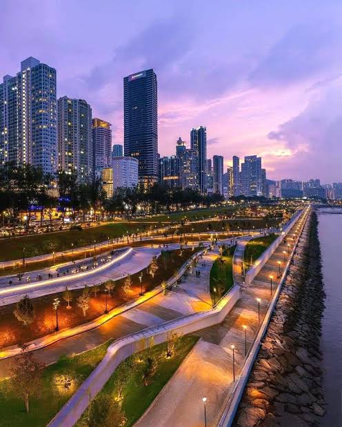 Waterfront park and promenade at dusk near The Andaman Island, Penang