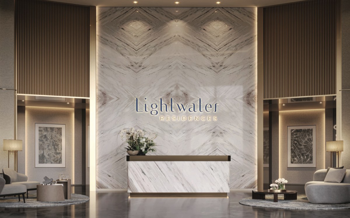 Lightwater Residences double-height arrival lobby with marble feature wall and resident lounge